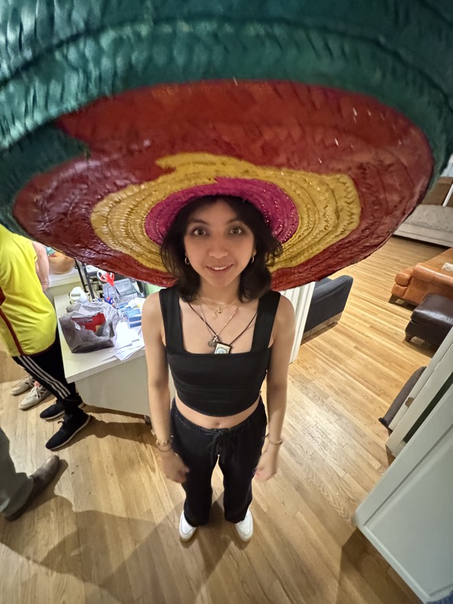 Megan under a very large sombrero, photographed from above